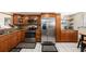 Traditional kitchen features stainless steel appliances, granite countertops, and ample wooden cabinetry at 6308 Newtown Cir # 8C5, Tampa, FL 33615
