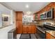 Charming kitchen featuring granite countertops, modern appliances, and stylish cabinetry at 6308 Newtown Cir # 8C5, Tampa, FL 33615
