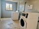 On-site laundry room with washers and dryers, providing convenience for residents and easy maintenance at 6308 Newtown Cir # 8C5, Tampa, FL 33615