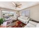 Bright living room with large sliding glass doors that lead to a relaxing hammock and beautiful view at 6308 Newtown Cir # 8C5, Tampa, FL 33615