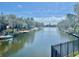 Serene waterfront view showcasing the tranquil canal, docks, and boat slips for waterfront living at 6308 Newtown Cir # 8C5, Tampa, FL 33615