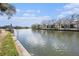 Canal view with boat dock showcasing waterfront living with nearby houses and beautiful blue skies at 6308 Newtown Cir # 8C5, Tampa, FL 33615