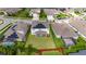 Aerial view of a home with a large backyard, solar panels, and surrounding neighborhood at 7528 Paradiso Dr, Apollo Beach, FL 33572