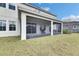 Backyard featuring a screened patio at 7528 Paradiso Dr, Apollo Beach, FL 33572