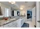 A luxurious bathroom featuring double sinks, granite countertops, and a serene atmosphere at 7528 Paradiso Dr, Apollo Beach, FL 33572