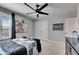 This bedroom has a ceiling fan, closet, and window at 7528 Paradiso Dr, Apollo Beach, FL 33572