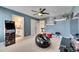 The game room features an arcade game, a cool beanbag chair, and shelving for collectibles at 7528 Paradiso Dr, Apollo Beach, FL 33572