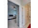 Hallway leading to a bedroom and bathroom, showcasing the home's layout and design elements at 7528 Paradiso Dr, Apollo Beach, FL 33572
