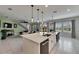 Spacious open-concept kitchen with an island and eat in kitchen, seamlessly connected to the living area at 7528 Paradiso Dr, Apollo Beach, FL 33572