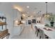 Bright kitchen with long countertop, stainless steel appliances, and modern dining area at 7528 Paradiso Dr, Apollo Beach, FL 33572