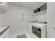 A laundry room has a sink and laundry machines at 7528 Paradiso Dr, Apollo Beach, FL 33572