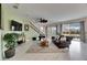 Open-concept living room features a custom ceiling fan and ample natural light at 7528 Paradiso Dr, Apollo Beach, FL 33572
