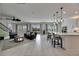 Light-filled living room boasts sliding glass doors and bar top seating at 7528 Paradiso Dr, Apollo Beach, FL 33572