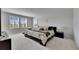 Bright main bedroom with large windows and a comfortable seating area at 7528 Paradiso Dr, Apollo Beach, FL 33572