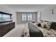 Large main bedroom with carpet and a bed with a floral comforter and pillows at 7528 Paradiso Dr, Apollo Beach, FL 33572