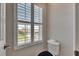 A toilet room has a window with shutters at 7528 Paradiso Dr, Apollo Beach, FL 33572