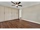 The main bedroom features wood floors and built in cabinetry at 7821 Yucca Dr, New Port Richey, FL 34653