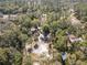 Aerial view of a home nestled among mature trees in a tranquil and private setting at 9641 Fulton Ave, Hudson, FL 34667