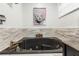 Close up of the bathroom soaking tub and stone surround at 9641 Fulton Ave, Hudson, FL 34667