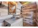 Elegant bathroom featuring a modern concrete sink and shower with stylish wood-look tile at 9641 Fulton Ave, Hudson, FL 34667
