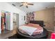 Bedroom with a round bed, walk-in closet, and lots of light at 9641 Fulton Ave, Hudson, FL 34667