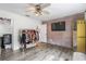 Large bedroom with exposed brick wall and wardrobe area at 9641 Fulton Ave, Hudson, FL 34667