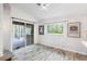 Bright dining area features wood-look tile floors and a sliding glass door to the outdoor living area at 9641 Fulton Ave, Hudson, FL 34667