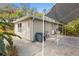 Exterior shot of home and adjacent carport at 9641 Fulton Ave, Hudson, FL 34667