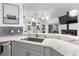 Stylish kitchen featuring marble countertops, stainless steel appliances, and open layout at 9641 Fulton Ave, Hudson, FL 34667