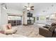 Bright and spacious living room with a brick fireplace and large windows for natural light at 9641 Fulton Ave, Hudson, FL 34667