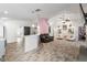 Spacious living area featuring a breakfast bar, modern furnishings, and an open layout at 9641 Fulton Ave, Hudson, FL 34667