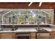 This outdoor bar is fully equipped with a sink, refrigerator, and beer tap for the ultimate outdoor entertaining at 9641 Fulton Ave, Hudson, FL 34667