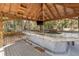 Unique outdoor kitchen area featuring rope swings and outdoor grilling area at 9641 Fulton Ave, Hudson, FL 34667