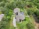 Aerial view of the property showcasing the house, pool, and surrounding landscape at 11505 Heron Hills Ln, Riverview, FL 33569