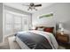 Modern bedroom with a large bay window, neutral color scheme, and two bedside tables at 11505 Heron Hills Ln, Riverview, FL 33569