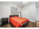 Bedroom with hardwood flooring, large closet, minimalist decor, and grey painted walls at 11505 Heron Hills Ln, Riverview, FL 33569