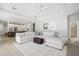 A well-lit living room adjacent to the kitchen features a comfortable sectional and decorative pillows at 11505 Heron Hills Ln, Riverview, FL 33569