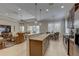 Open kitchen with granite counters, stainless appliances, and an eat-in dining area at 11610 Griffith Park Ter, Bradenton, FL 34211