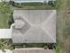 Aerial view of a well-maintained roof on a single-Gathering home surrounded by lush landscaping at 11610 Griffith Park Ter, Bradenton, FL 34211