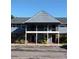 Two-story condominium with stairs, parking area, and covered space on both floors at 200 Country Club Dr # 903, Largo, FL 33771