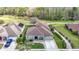 Aerial view of a single-story home with lush landscaping and a well-maintained exterior at 25950 Risen Star Dr, Wesley Chapel, FL 33544