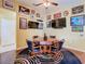 Game room with a poker table, unique decorations, hardwood floors, and comfortable chairs at 25950 Risen Star Dr, Wesley Chapel, FL 33544