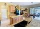 Well-equipped kitchen boasts granite countertops, stainless steel appliances, and a center island for ample workspace at 25950 Risen Star Dr, Wesley Chapel, FL 33544