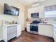 Well-equipped kitchen with stainless steel appliances, white cabinets, and a functional layout at 25950 Risen Star Dr, Wesley Chapel, FL 33544