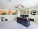Spacious office area featuring neutral carpeting and a large, dark wood executive desk at 25950 Risen Star Dr, Wesley Chapel, FL 33544