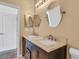 Well-lit bathroom with double sinks, granite countertops, and modern fixtures for a luxurious feel at 3106 Bayshore Oaks Dr, Tampa, FL 33611
