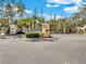 Gated community entrance with signage and well-maintained landscaping under a blue sky at 3106 Bayshore Oaks Dr, Tampa, FL 33611