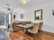 Inviting living room features an open floor plan, hardwood floors, and a dining area perfect for entertaining at 3106 Bayshore Oaks Dr, Tampa, FL 33611