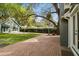 Spacious backyard with brick pavers, green lawn, and a basketball hoop at 3115 W Fair Oaks Ave, Tampa, FL 33611