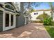 Picturesque backyard featuring brick pavers and beautiful landscaping at 3115 W Fair Oaks Ave, Tampa, FL 33611